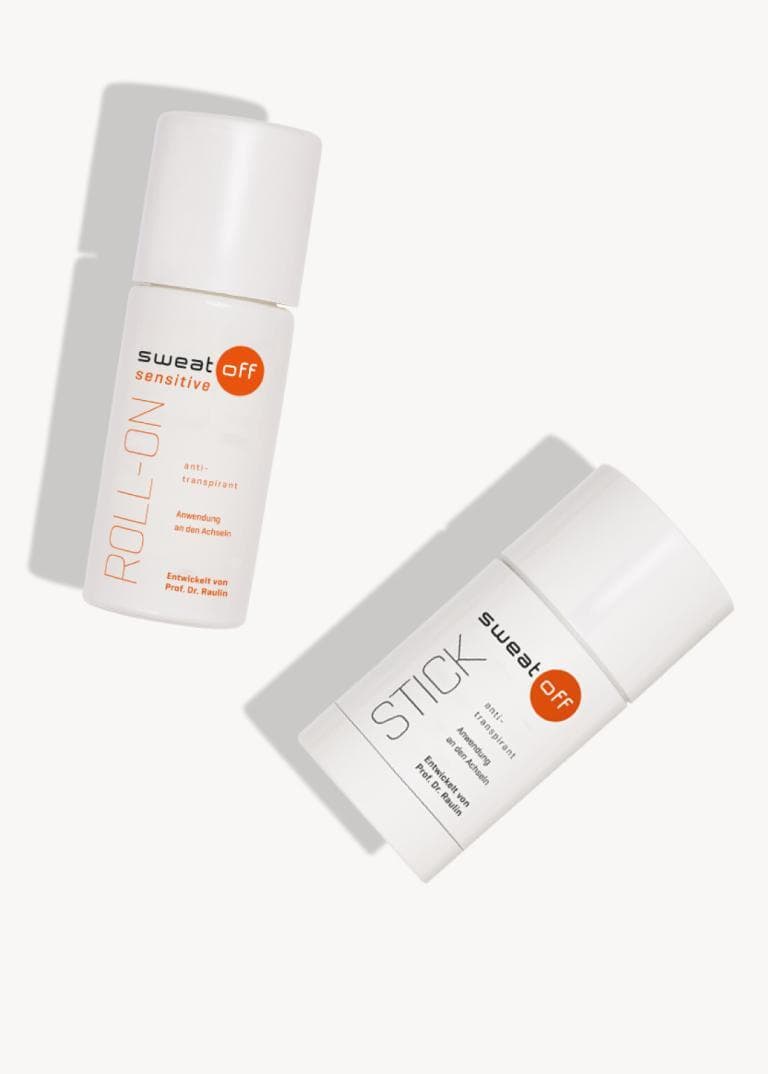 Sweat-Off Sensitive Roll-On und Stick liegend auf weißem Hintergrund