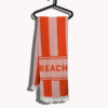 Seatowel Orange, Rosa auf Kleiderbügel mit Beach Schriftzug